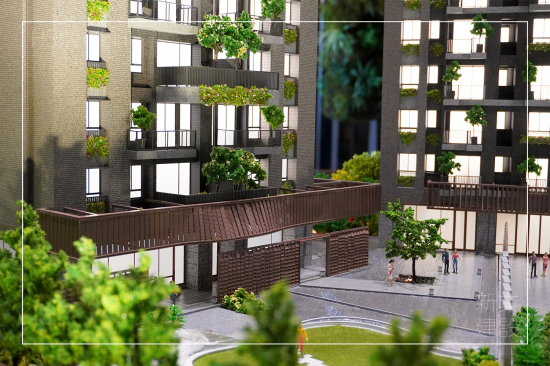 位於14期的新業(yè)大塊藏硯，清水模的素樸靜謐，敘寫入口的沉穩(wěn)基調(diào)，片片金屬瓦片牆景，彷彿風(fēng)吹水波粼粼，翻飛一曲樂章。